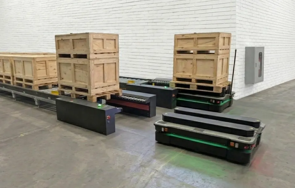 Two autonomous mobile robots working alongside a conveyor that handles wooden crates in a warehouse
